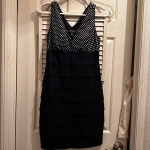 En focus Studio black dress with white polka dots.